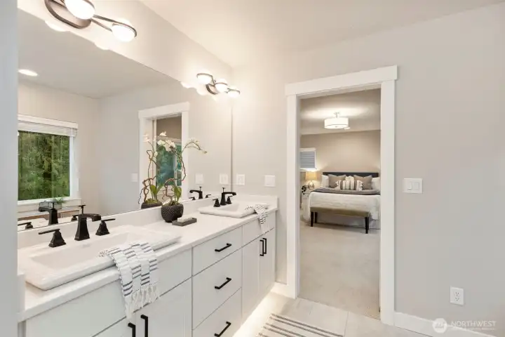 Primary bath with upgraded finishes and spa-inspired feel.