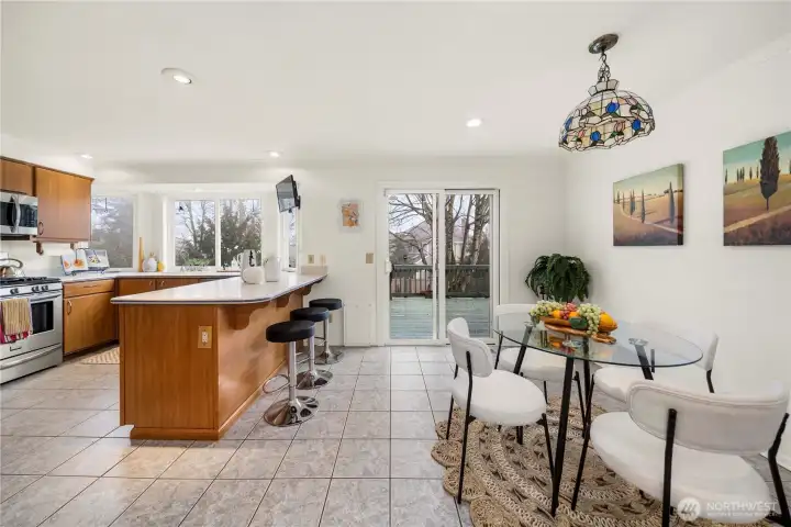 Overlooking the Back Yard, the 2nd (informal) Dining Area is adjacent to the Kitchen. The space is perfection!