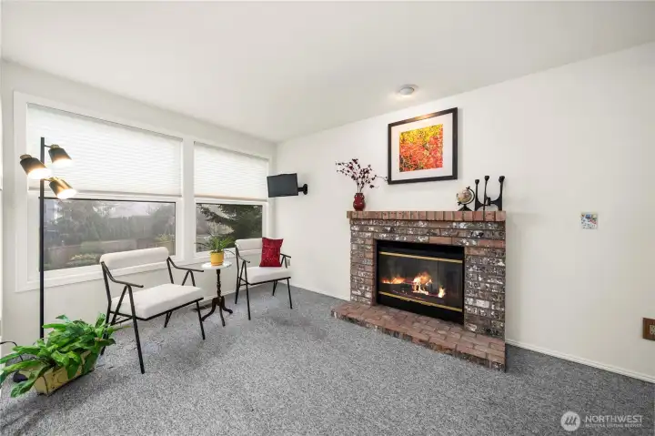 And right around the corner, still on the Main Floor……. is THE GUEST/MIL Suite! This is the sitting area, with a fireplace #2 and looking out over the backyard.