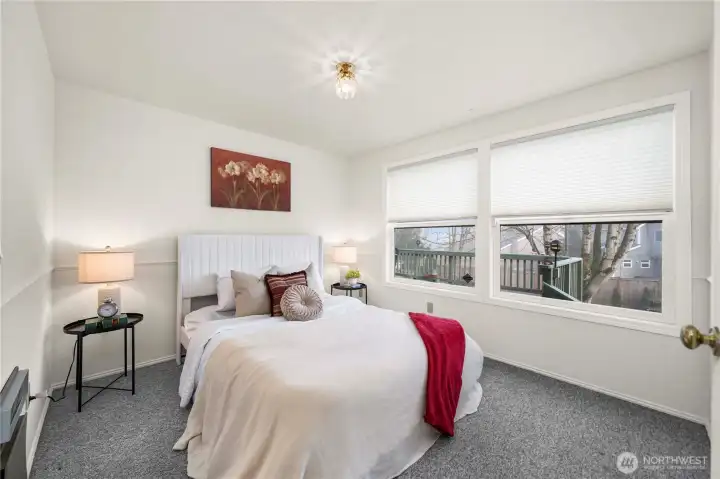 The Guest Suite Bedroom also overlooks the backyard.