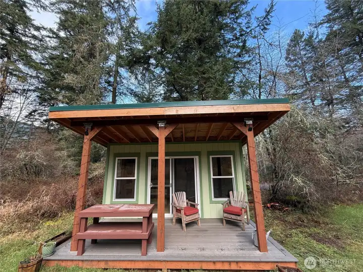 Outbuilding with spacious covered deck