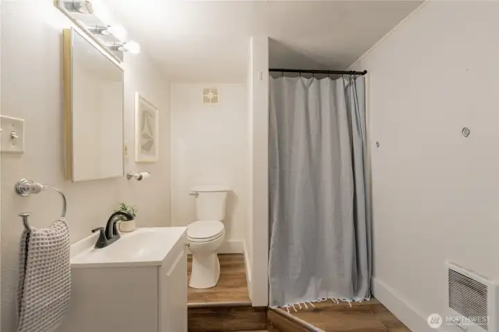 Lower-level bedroom with en-suite bathroom.