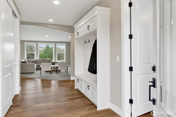 A spacious entryway with built-in cabinets