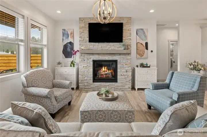 A cozy propane fireplace serves as the focal point of the living room, adding warmth and a comfortable ambiance to the space.