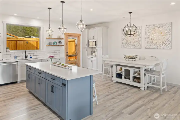 A door from the dining area opens to an amazing covered outdoor living space, extending the home’s living and entertaining area seamlessly outdoors.