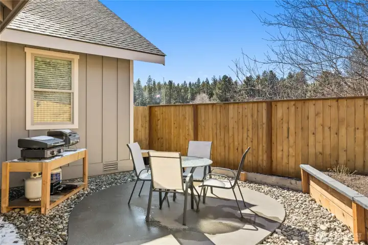 A third outdoor area is set up for BBQ and dining, with the flexibility to also serve as a hot tub space, depending on your lifestyle needs.