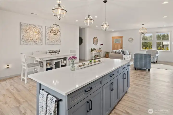 A small hallway to the left provides a transition to the primary suite, offering a sense of privacy and separation from the main living area.