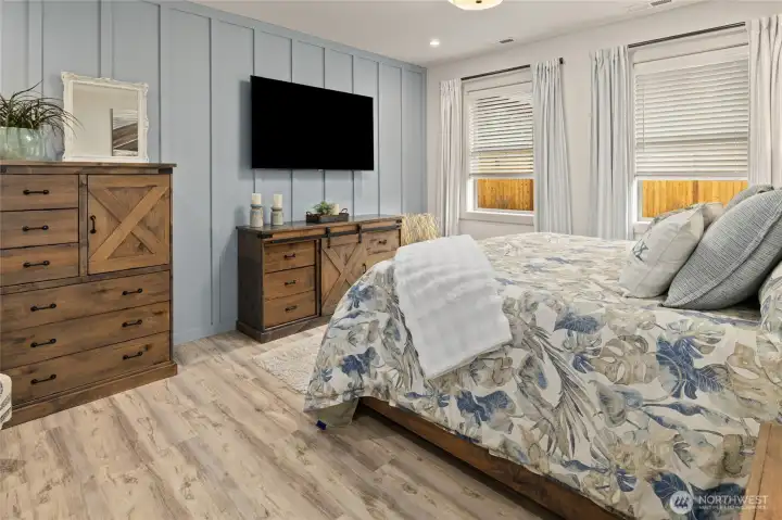 A designer board and batten accent wall in the primary suite adds a stylish, custom touch.