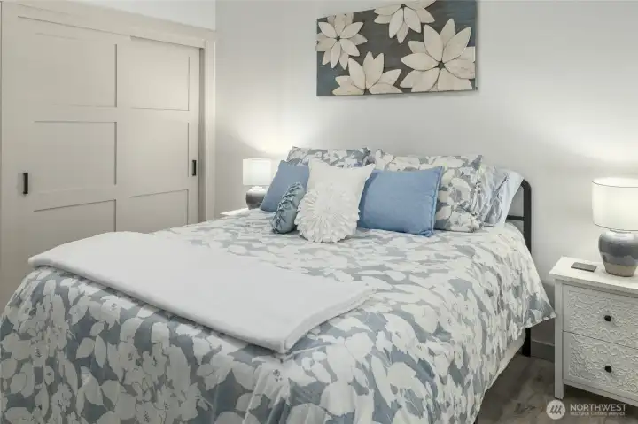 The guest room is functional and well-appointed, offering a comfortable and practical space for visitors.