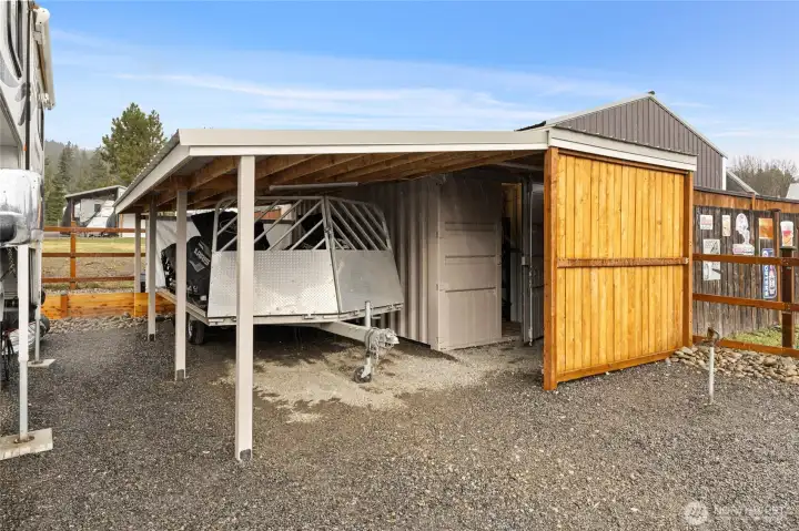 The Conex container and storage carport can remain with the property, or the space offers flexibility to add a shop if desired.