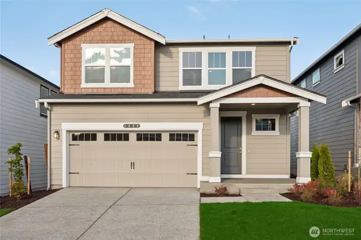 Stunning two-story home exterior with covered patio/entry. Photos are representative only and may display different color packages and/or upgrades.