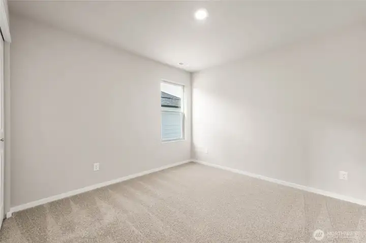 Comfortable secondary bedroom. Photos are representative only and may display different color packages and/or upgrades.