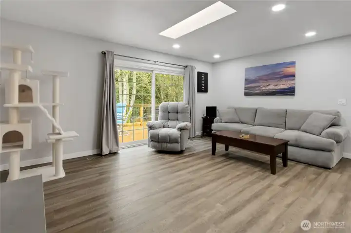 The family room is so large, there is room for most furniture. The skylights let in even more light. The back deck is trex-type decking, you never have to paint!