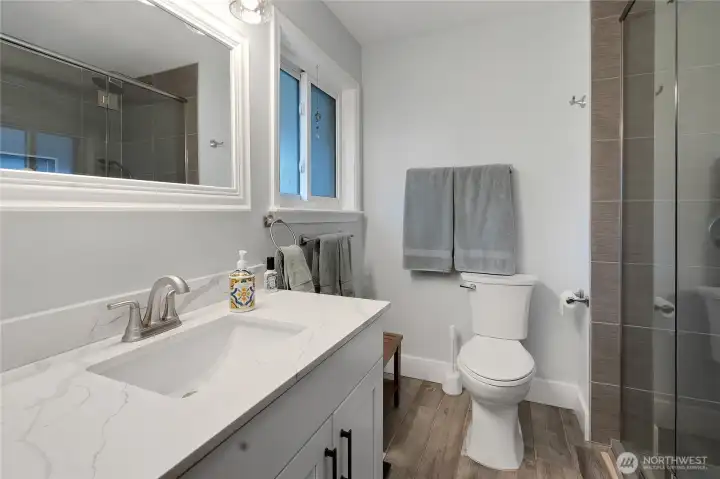 The primary bath is elegant and useful. Two person shower to your right, wow!