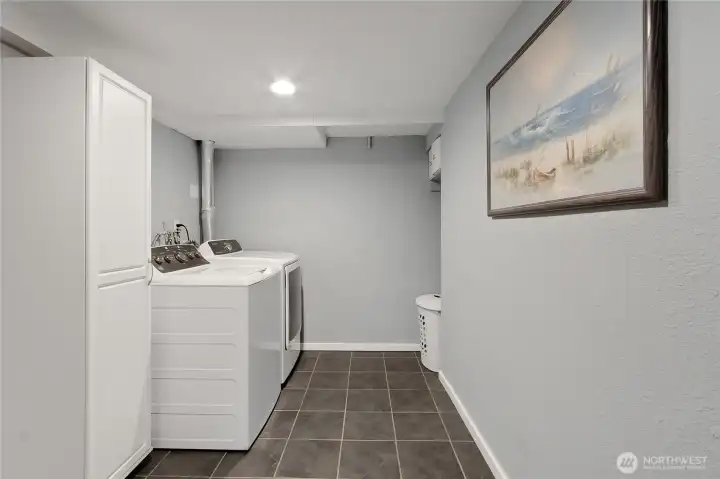 The utility room with extra cabinet space.