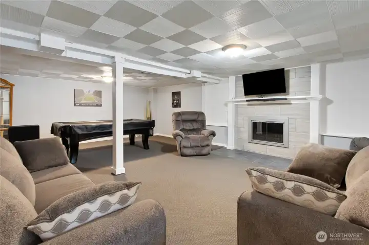 This Living room, game room, MIL set up can be whatever you want to make of it. The wood burning fireplace and mounted tv just add to this room's versatility.