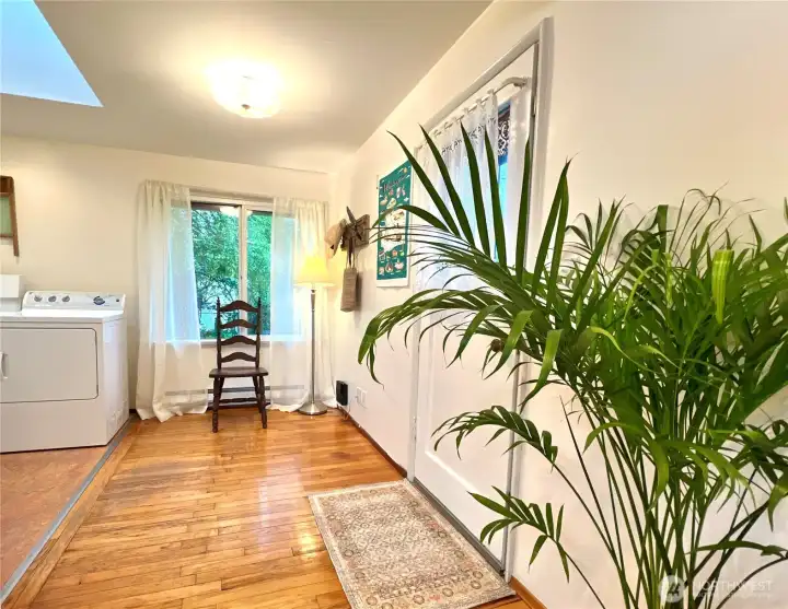A large west facing window is located where a breakfast table could be overlooking the large back yard.