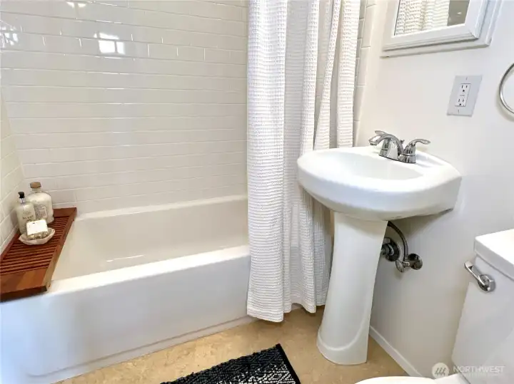 The new neutral flooring is Marmoleum. A newer product made from earth-friendly materials. It feels like it could have been here when the home was built