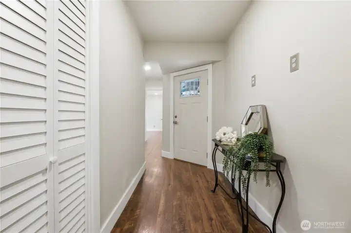 Hallway to primary bedroom and outdoor to backyard