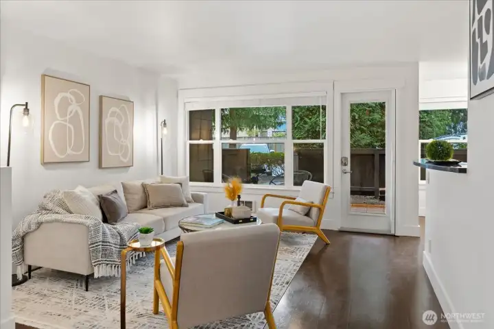 Living room open to kitchen and dining space.