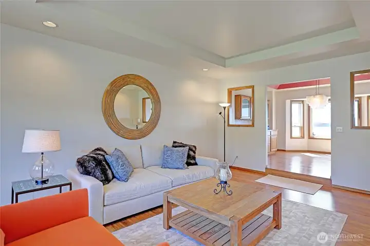Formal Living Area w/ Plank Flooring and Coffered Ceilings~
