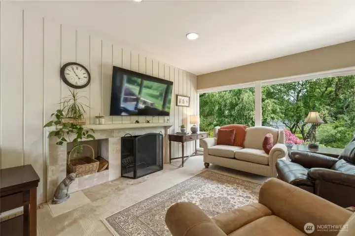 Family room with cozy fireplace and gorgeous views.