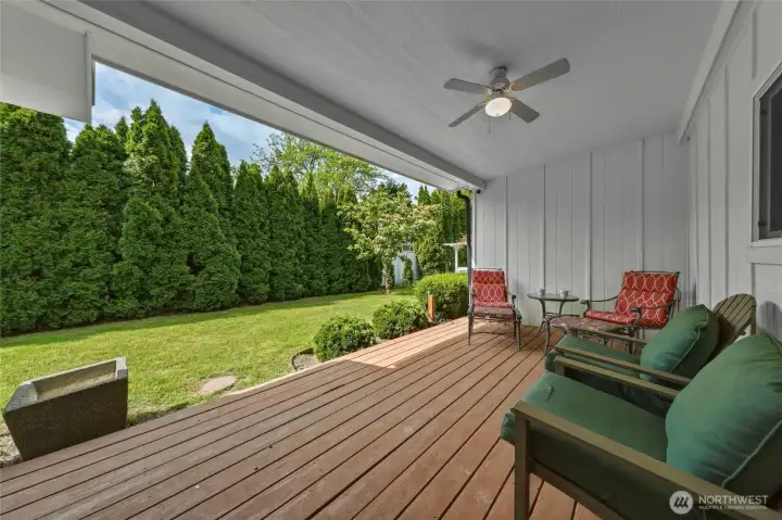 South facing covered deck off breezeway entrance.
