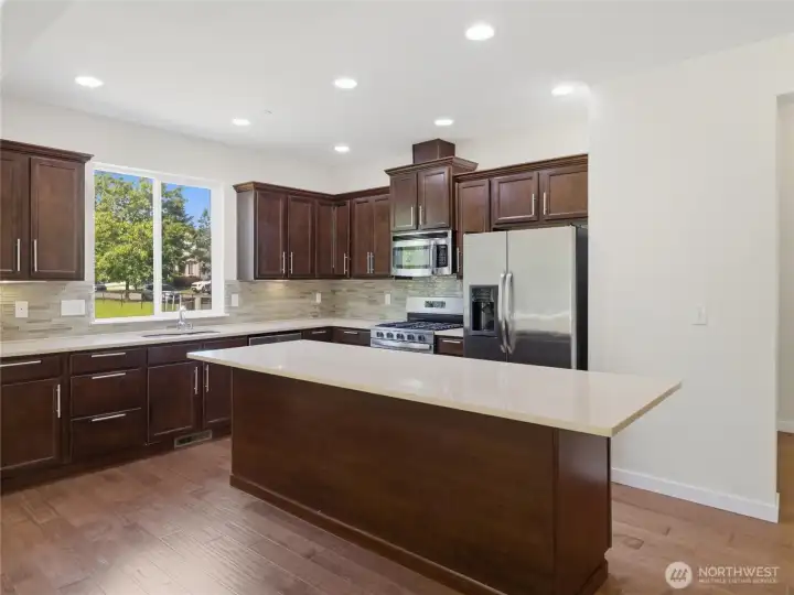 SOLID COUNTERS, SS Appliances, Glass Backsplashes!!!!   Entry on Right
