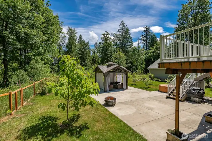 Fun gazebo surrounded by garden w/ concrete patio great for outdoor entertaining and relaxing Fun gazebo surrounded by garden w/ concrete patio great for outdoor entertaining and relaxing