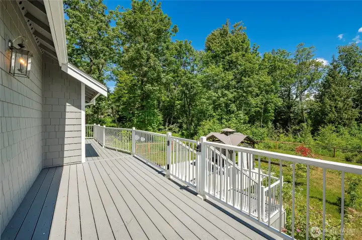 main level deck off of kitchen and primary bedroom w/ wooded privacy main level deck off of kitchen and primary bedroom w/ wooded privacy