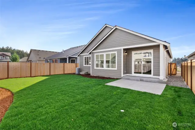 Fully landscaped front & backyards. Photo of a similar home, not actual.