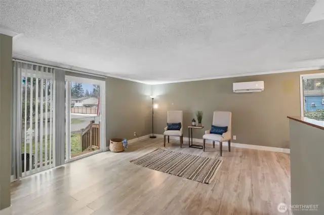 Living area with slider patio doors.