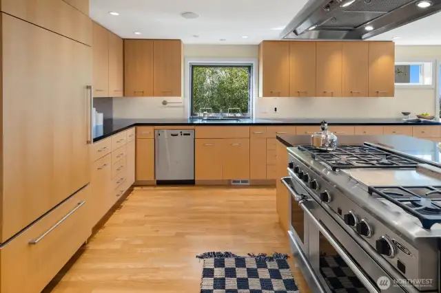 -Profuse cabinetry and ample natural light make cooking all the more fulfilling in this bright kitchen.