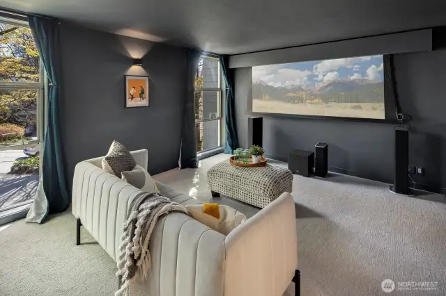 -One of four in the house, this main floor bedroom currently doubles as a screening room.