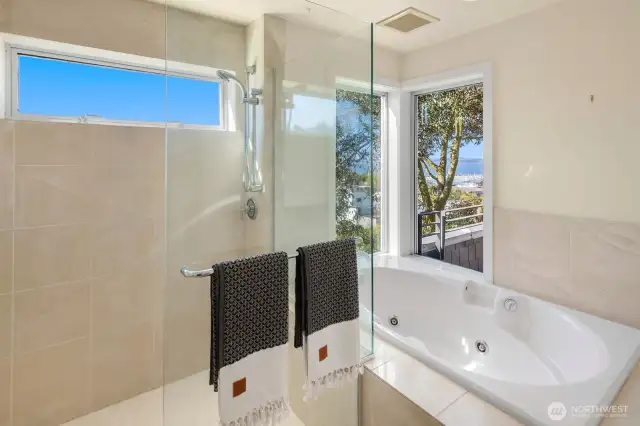 -Soak away the day while you soak up the views!   A large bathtub is positioned in a corner window for the ultimate in self-care.
