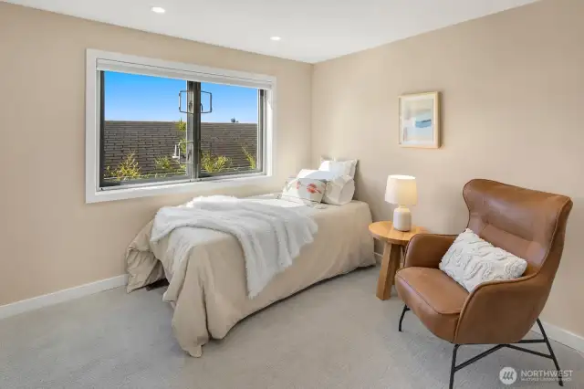 -This second-floor bedroom makes closet space a priority and comfort an essential.