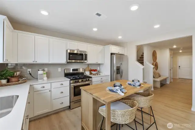 See supplements for colors in home. Home has gray cabinets.