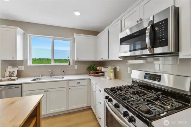 See supplements for colors in home. Home has gray cabinets.