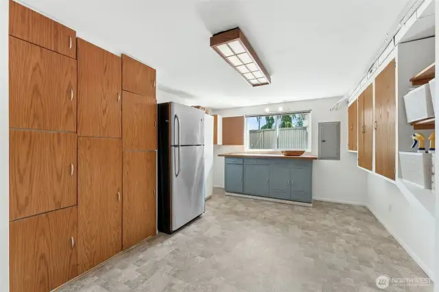 Did I mention...huge laundry/storage area!  Amazing storage with built in cabinets and shelving, plus extra fridge stays with the house!