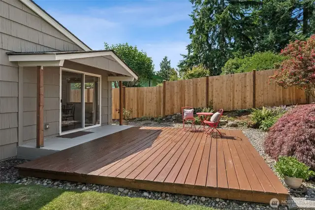 Slider from dining room leads to your level, fenced back yard with gorgeous landscaping and fruit trees.