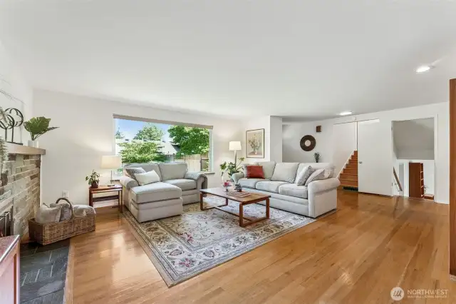 Looking from the dining area, through the living room you'll see the stairs going up to the bedrooms and down to family room and laundry.