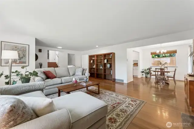 This view is from the fireplace in the living room, to the dining area and entry to kitchen.  The slider off the dining room leads you out to a private deck and gorgeous yard with fresh fruit and flowers!
