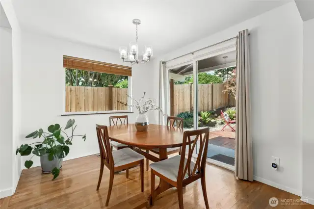 You start to see a glimpse of the outdoor beauty here through the dining room slider.  Beautiful hardwoods, new lighting and great natural light are great indoor perks, and the great party deck will move you outdoors as our summer comes into view.