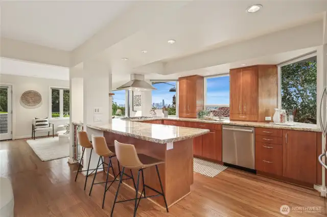 The kitchen layout is perfect for entertaining, and the home chef will appreciate the nice City views, gas cooktop, and plenty of cabinets and counter space.