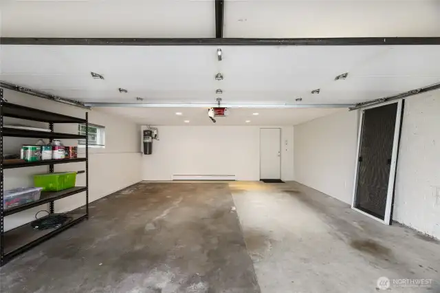 The 2-car garage with heat, built-in speaker system, and hot/cold water spigot!