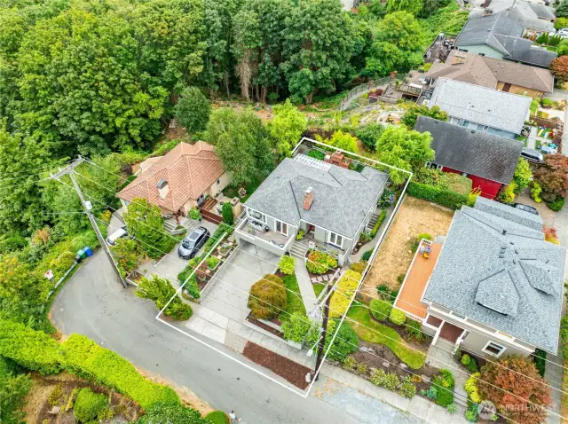 The dead-end street location is very quiet and is close to wooded areas offering serene privacy yet still near the benefits of urban living.  The large driveway offers off street parking in addition to the 2-car garage.