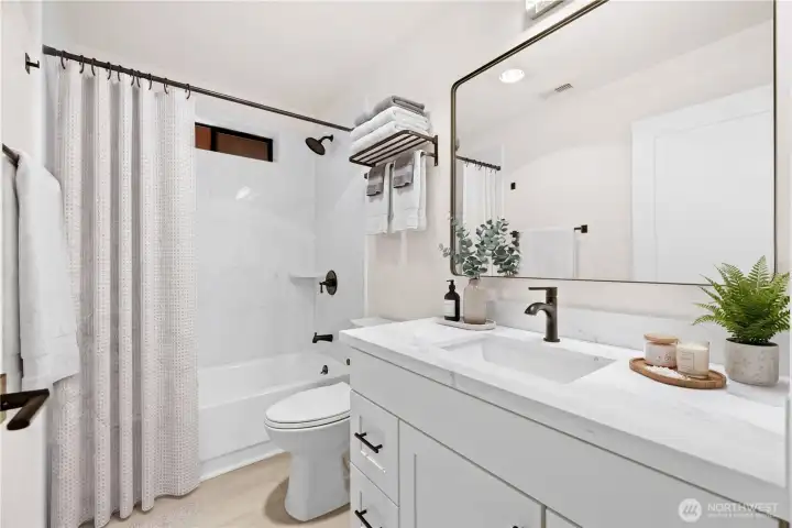Beautiful harmonious design in two full bathrooms (virtually staged)