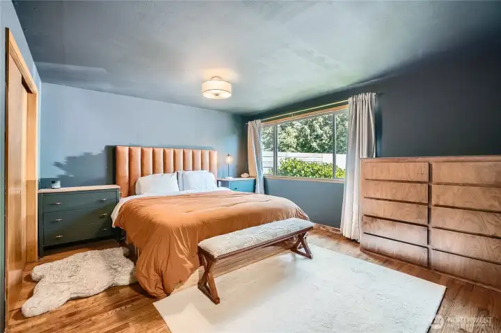 Step into the serene primary suite featuring a cozy fireplace, walk-in closet, and generous natural light through large picture windows. Thoughtfully designed with comfort in mind, this spacious retreat offers the perfect blend of style and relaxation—your personal haven at the end of the day.