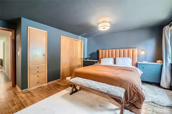 Step into the serene primary suite featuring a cozy fireplace, walk-in closet, and generous natural light through large picture windows. Thoughtfully designed with comfort in mind, this spacious retreat offers the perfect blend of style and relaxation—your personal haven at the end of the day.