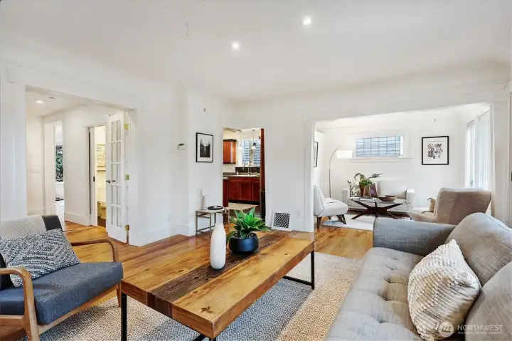 Circular floor plan. French doors on left into the den. Single doorway into kitchen in center.